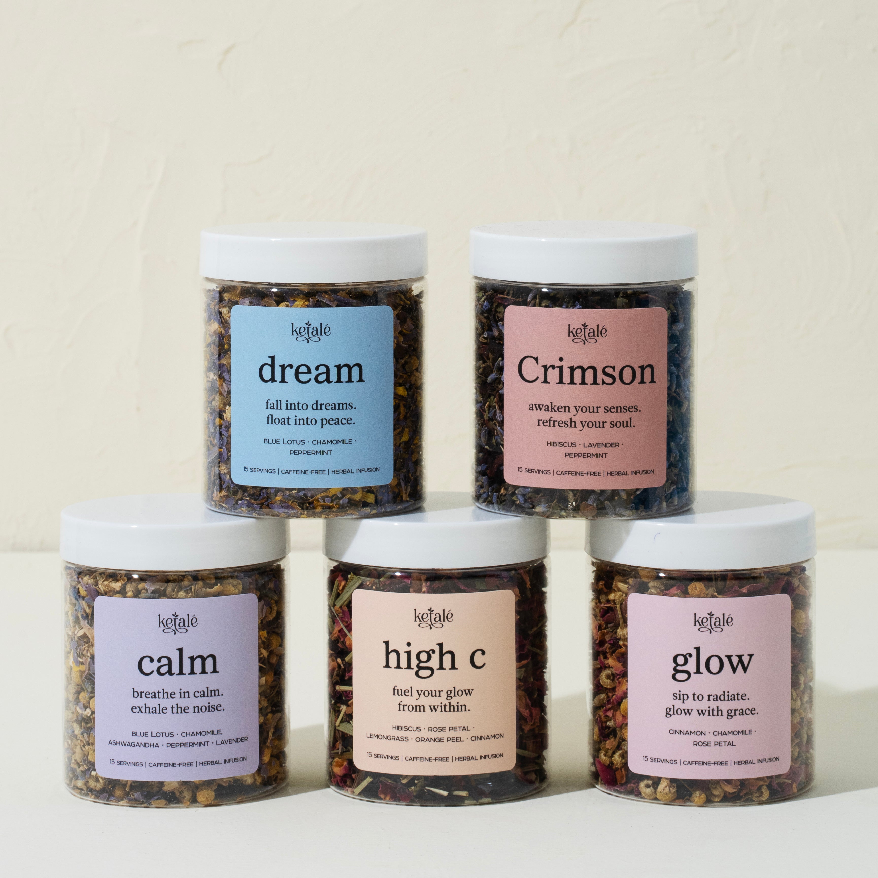 The image features five pastel-labeled jars of herbal tea blends from Ketale, each promoting wellness with unique ingredients and calming taglines. Arranged artfully on a cream background, the teas evoke themes of serenity, radiance, and inner peace.